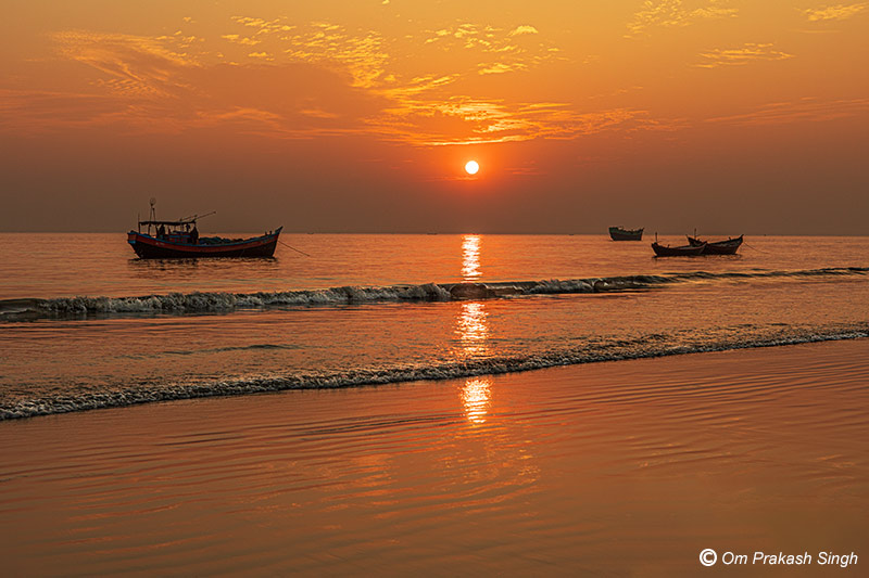 Setting Sun and its glittering reflection in the delta waters along the coast of Sagar Island helps improve mental health in South 24 Parganas district, West Bengal